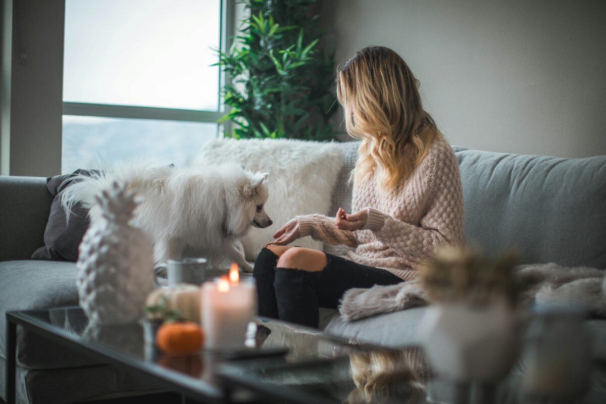 woman on sofa with dog in shared ownership mortgage property