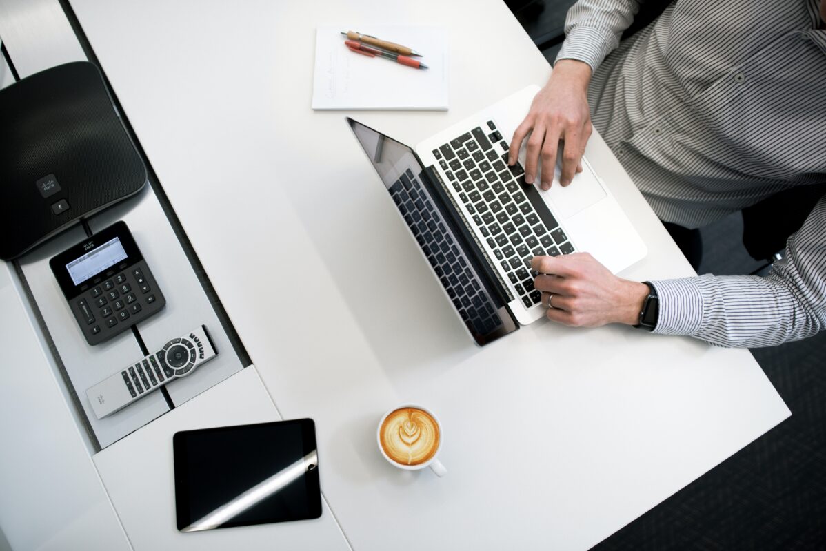 Male Investor at Laptop looking at mortgages